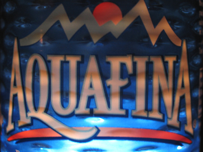 A bottle of water illuminated by three flashlights.  Why, what did you think it was?