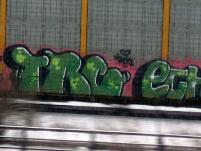 How do those graffiti artists spray paint a moving train?