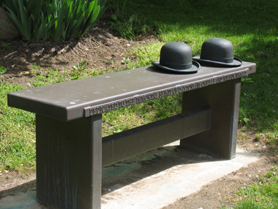 The gentlemen`s hats Await their returning like Obedient dogs.