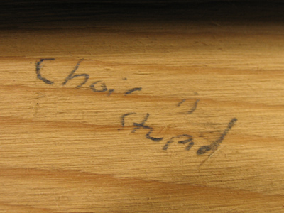 Scrawled on the bottom of a set of risers -- for a choir.