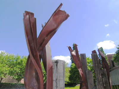 I`m not entirely certain, but I think this twisted red metal sculpture is an homage to beef jerky.