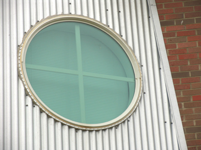 A porthole is a window.  A portal is a door.  A door is ajar.  [Stop me, before I pun again.]