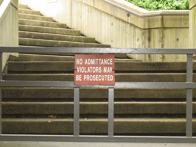 The three-foot-high barrier, along with the ambiguously threatening sign, keep tresspassers out of Fraze Pavilion.