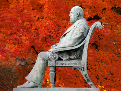 Seasons come, seasons go, while still he sits.