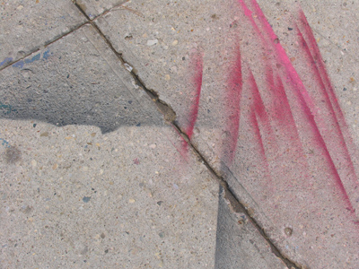 The black paint is old, the red is new.  You`d think the red paint person might`ve learned from the other`s mistakes.