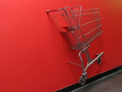 Shopping cart emerging from wall, of course.