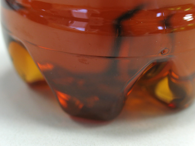 A drink with jam and bread.