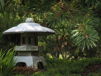 The gigantic Asukadera Temple, erected in Japan during the 6th century, dwarfs the surrounding forest.