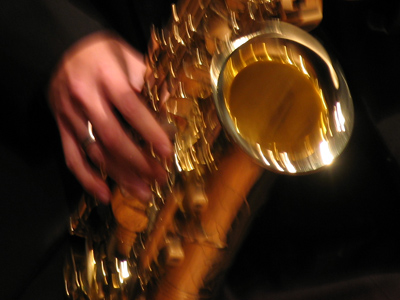 The term `attack` is used to describe musical performance technique.  This saxophonist takes it literally.