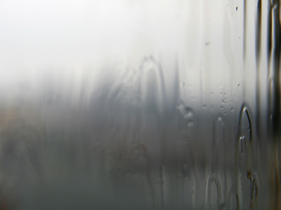 The downtown Dayton skyline, seen through a rainy window.