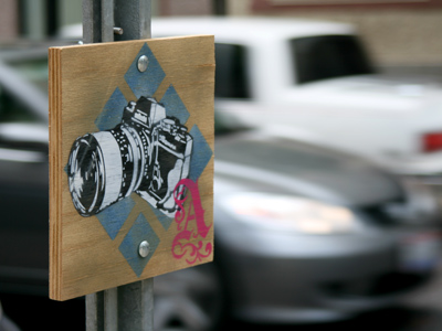 A hand-painted camera with the letter A.  I`m not sure what it means, but I`m taking this sign as a sign.