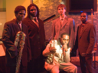 He suggested I take pictures at a performance his quintet was giving tonight at a downtown restaurant.