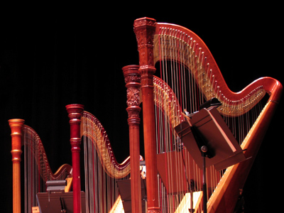 Harpists spend half their time tuning and the other half lugging their instrument around.