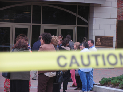 A crowd of evacuees, CAUTION tape, a fire truck and police car:  these should have warned me off, but they only made me come closer.
