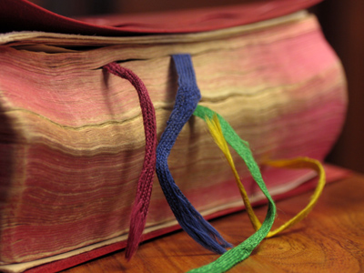 The ribbons help you keep your place in the book.  The book helps you keep your place in the world.