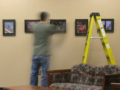 I`m the person who takes the photos, so I shouldn`t have to hang them as well.