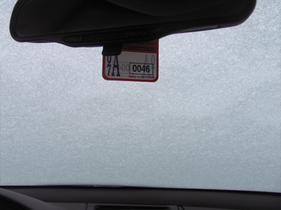 My car was covered with tiny white pebbles this morning.
