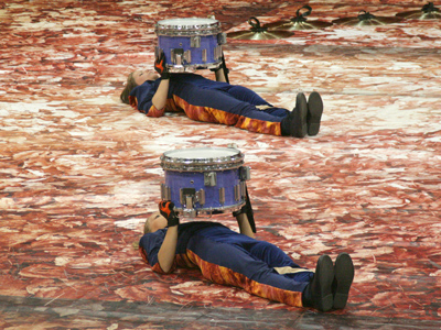 A flamenco singer, surrounded by palmeros.
