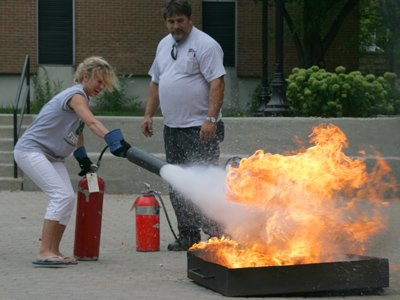 This prospective student was taking a campus tour, saw the fire extinguisher training going on and she jumped in with both flip-flops.