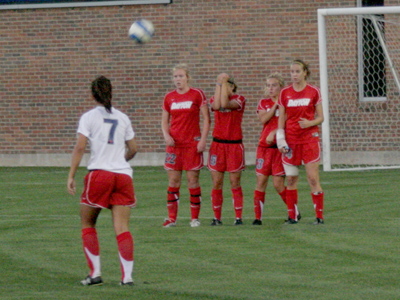 A rooommate of one of the players stood nearby as I took pictures.  She would shout things like, `GO LAUREN!  YOUR HAIR LOOKS GOOD!`