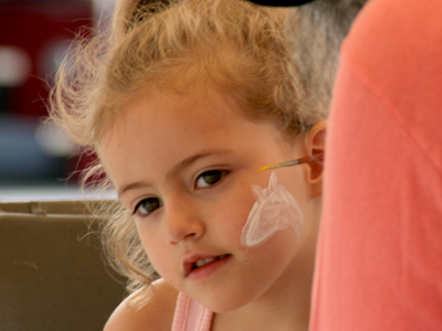 `I remember it was a festival . . . there were ducks . . . and someone painted my face.`