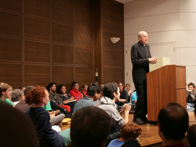 The priest`s lecture on atheism was sitting-room only.