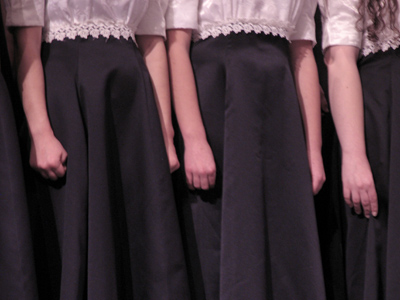 Maybe some of the red-dress singers from December 11, 2005, have now graduated to black dresses.