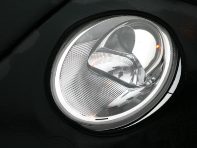 My reflection in the eye of a Volkswagen.