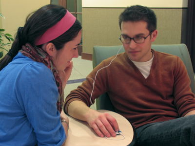 Sharing an iPod, one earbud each.