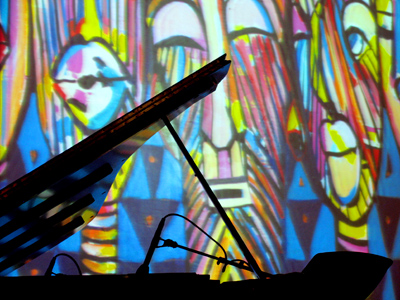 Grand piano, with artwork by Curtis Barnes, Sr.