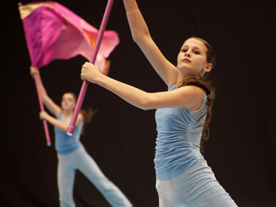 I shoot color guard differently than the professionals.  My pictures often feature one prominent team member in the foreground with others in the distance like a visual echo.