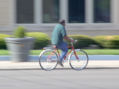 Without slowing down the cyclist said, `That man got some SKILLS.  I can tell by the way he`s holdin` that camera.`