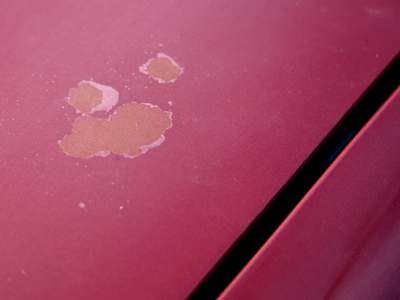 Due to some repair work, the hood of my 1996 car is about six years old.  Why is the paint on the hood peeling, when the rest looks fine?