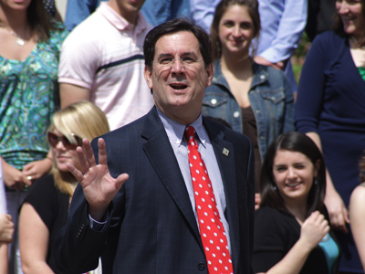 University of Dayton president Dan Curran greets graduating students and their families.