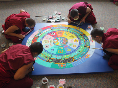 There was a sense of tranquil urgency as four monks worked together to finish the mandala in time for the ceremony during which it was to be destroyed.