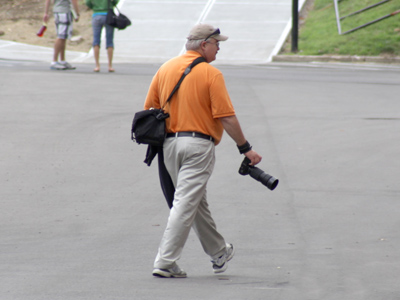 The official university photographer roams around campus taking pictures too, but he gets paid for it.
