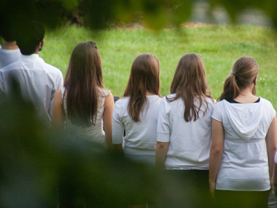 On the wrong side of the group photo.