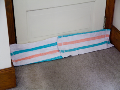 Old towels reduce the wind chill factor in my living room.