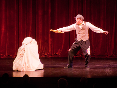 No matter what language or century it is, sticking a guy in a big sack and whacking him with a paddle will always please the audience.