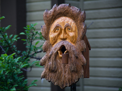 This face recently appeared next to my front porch.  It could be some sort of talisman to protect the house.