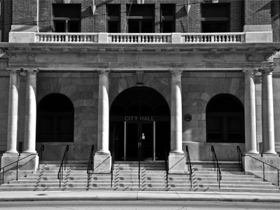 Her photographs of urban architecture are known for their clarity and precision, and also for their unerring symmetry.