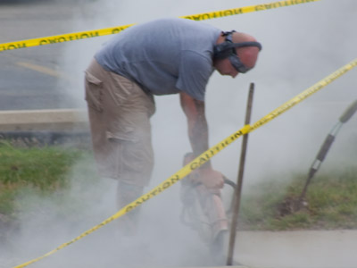 Another guy with dirty shoes (see June 15, 2010).  He has ear protection, but imagine all the stuff he`s breathing in.
