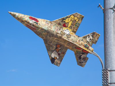A jet airplane covered with comic strips -- what does it look like?