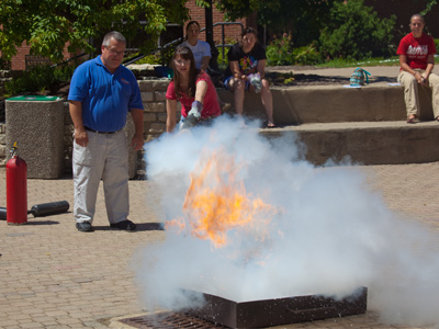 The student saves the day, while a man in a blue shirt stands by helplessly.