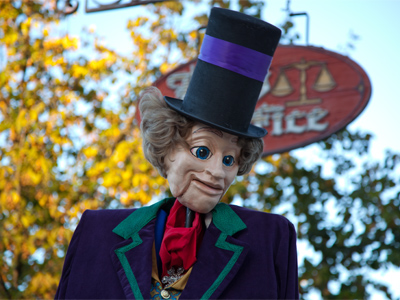 He wears that hat to make him look tall.