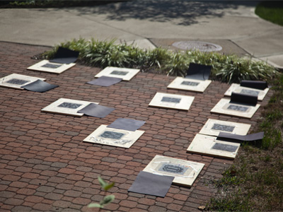 Art education students are working on a picture that has to be baked in the sun.