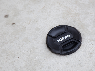 Some Nikon owner is walking around with a naked lens.  I left it where I found it.