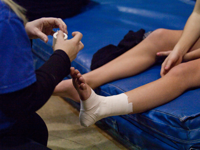 `Is it bad?` her coach asked.  She nodded.  But they taped her up and she continued to compete, limping and crying.