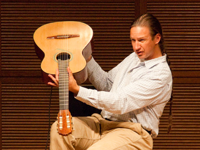 Understandably proud of his guitar, made by hand with advanced materials like carbon fiber and aircraft foam.