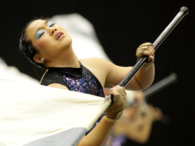 The whole thing seems kind of silly when you think about it:  spinning flags, rifles and swords inside of a gymnasium.